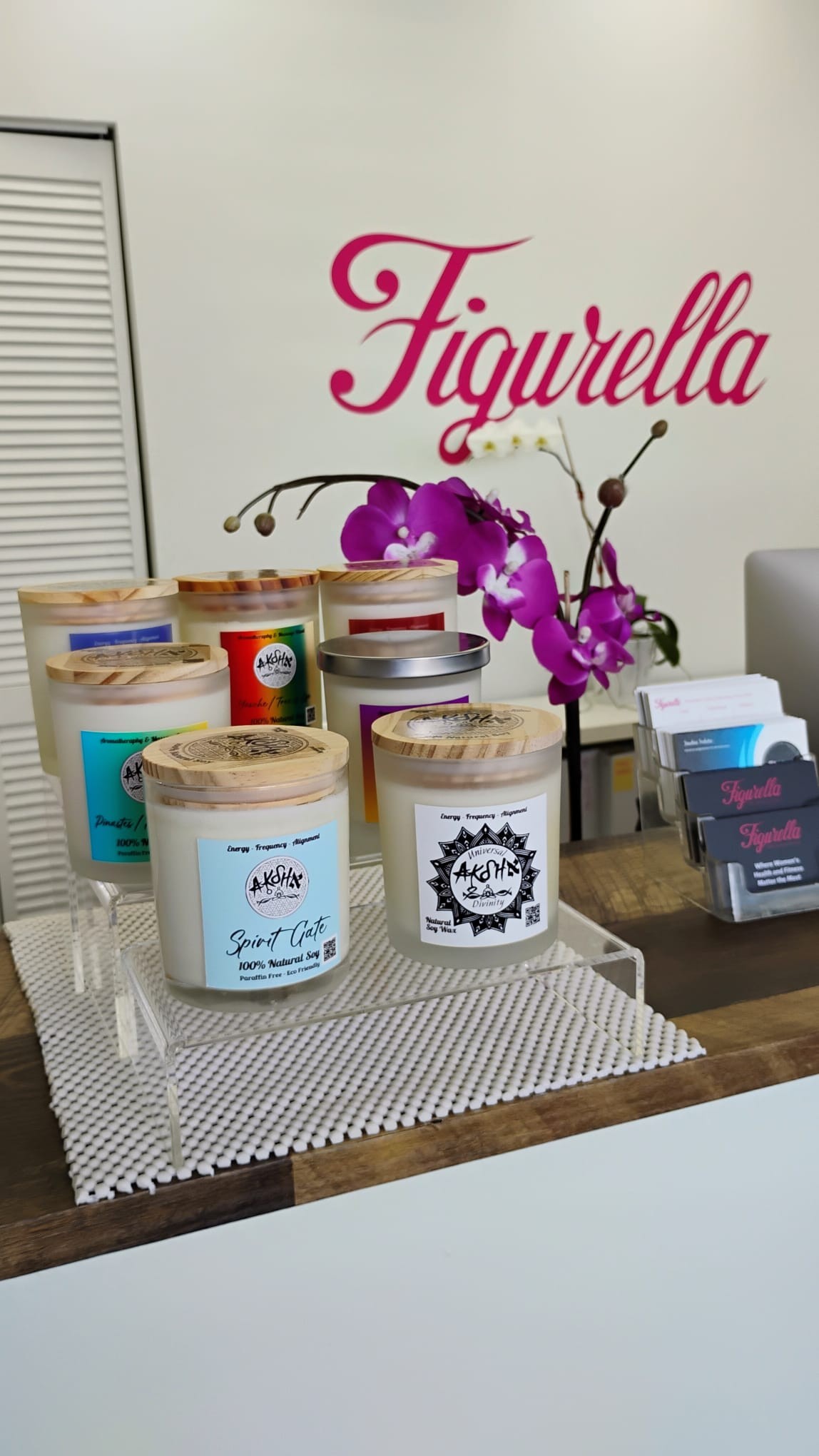 AKSHA Living massage candles displayed at Figurella Spa